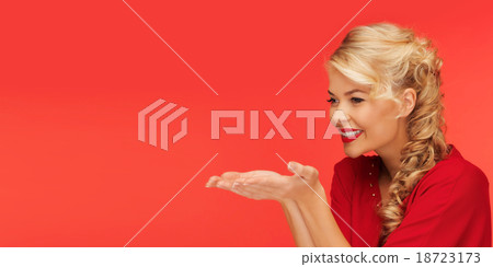 woman holding something on palms of her hands 18723173