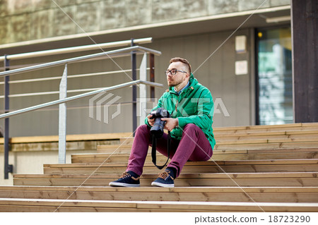 young hipster man with digital camera in city young hipster man with digital camera in city 18723290
