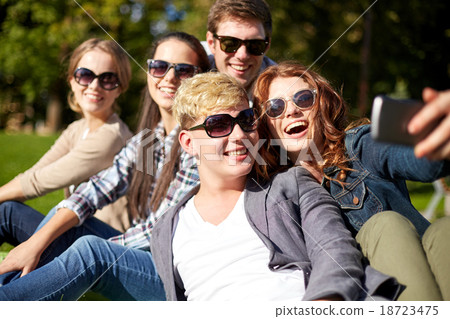 students or teenagers with smartphone at campus students or teenagers with smartphone at campus 18723475