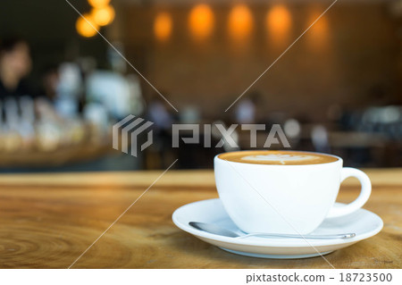 Hot art Latte Coffee in a cup on wooden table Hot art Latte Coffee in a cup on wooden table 18723500