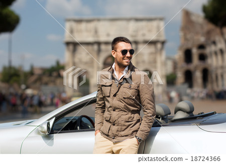 happy man driving cabriolet car over city of rome happy man driving cabriolet car over city of rome 18724366