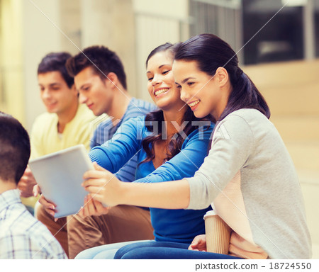 group of smiling students with tablet pc 18724550