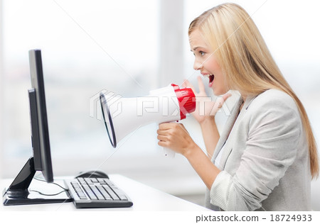 strict businesswoman shouting in megaphone 18724933