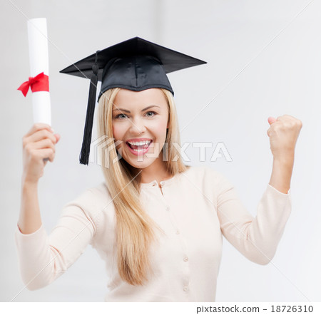 student in graduation cap with certificate 18726310