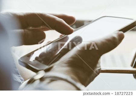 Older woman using her phone Older woman using her phone 18727223