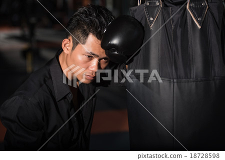 Exhausted businessman with boxing gloves 18728598