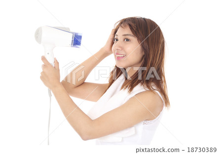 A woman wearing a shampoo and drying his hair with a hair dryer 18730389