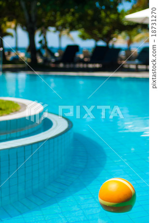The bright yellow ball in the pool 18731270