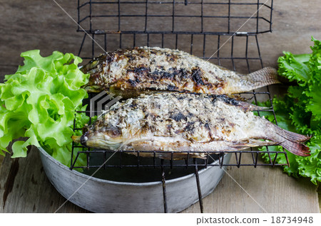 Salt crusted grilled nile tilapia fish Salt crusted grilled nile tilapia fish 18734948