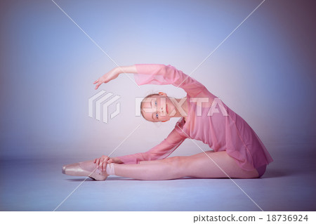 The young ballerina posing on the floor The young ballerina posing on the floor 18736924