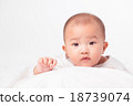 Asian baby lying on stomach. looking 18739074