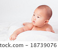 Asian baby lying on stomach. looking 18739076