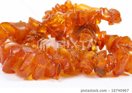 Amber beads  on white background 18740967