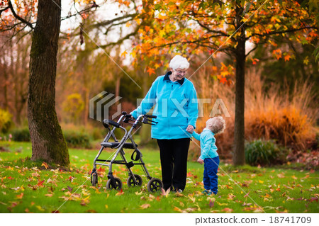 Senior lady with walker enjoying family visit 18741709