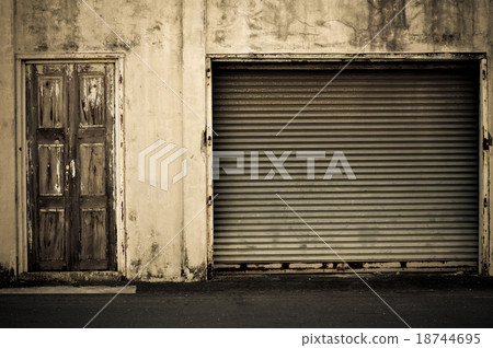 Illuminated grunge metallic roller shutter door Illuminated grunge metallic roller shutter door 18744695