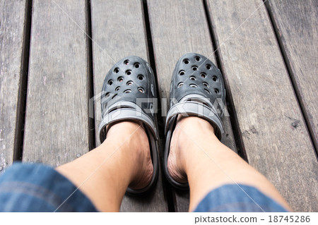 Shoes from an aerial view on wooden background Shoes from an aerial view on wooden background 18745286