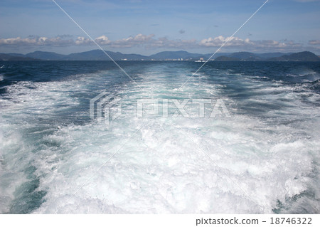 Waves from the boat engine running. 18746322