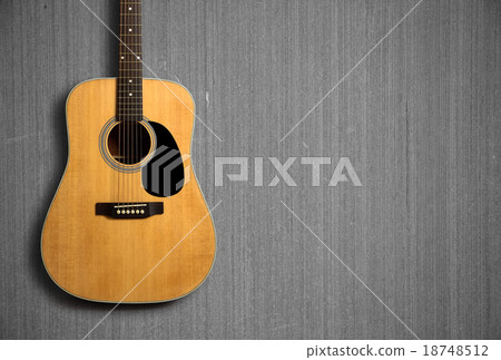 Acoustic guitar on wooden background 18748512