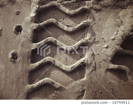 Wheel tracks on the soil. 18749911