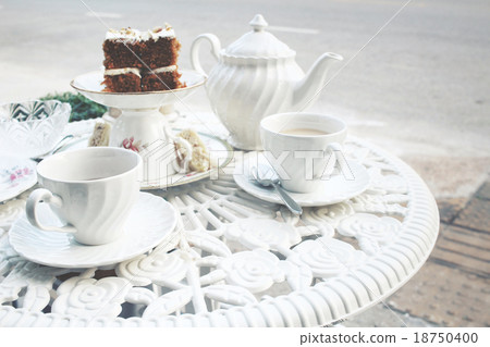 Carrot cake with hot tea Carrot cake with hot tea 18750400