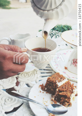 Carrot cake with hot tea Carrot cake with hot tea 18750415