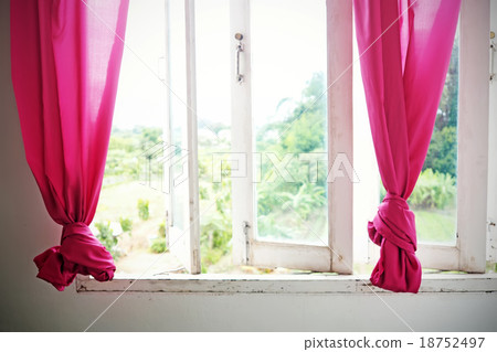 Pink curtain and white wooden window. Pink curtain and white wooden window. 18752497