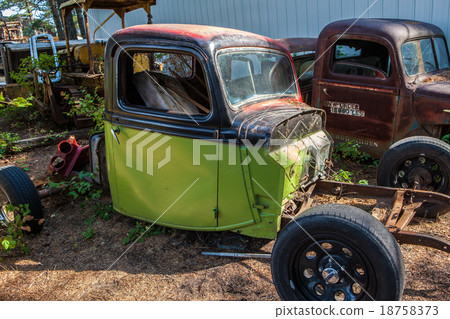 Old rusted car in junk yard Old rusted car in junk yard 18758373
