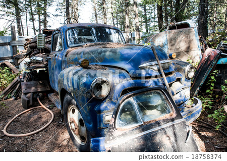 Old rusted car in junk yard Old rusted car in junk yard 18758374