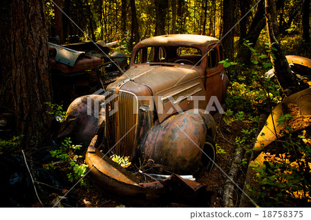 Old rusted car in junk yard Old rusted car in junk yard 18758375