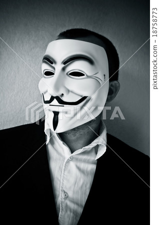 man wearing suit businessman and Vendetta mask. 18758773