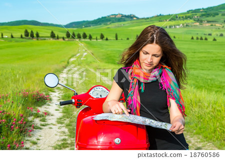 Young woman traveling by a scooter 18760586