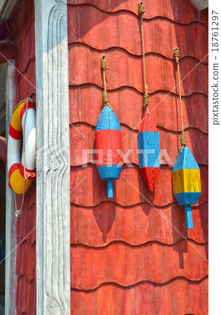 Colorful fishing buoys hanging on the wall Colorful fishing buoys hanging on the wall 18761297