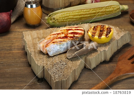 Single BBQ Grilled Salmon Steak On The Wood Board Single BBQ Grilled Salmon Steak On The Wood Board 18763819