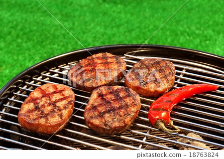 BBQ Hamburger And Chili Pepper On The Hot Grill 18763824