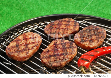 BBQ Hamburger And Chili Pepper On The Hot Grill 18763825