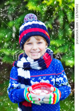 Little kid boy holding big cup with chocolate 18764402