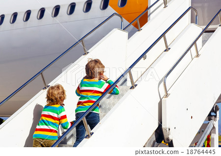 Two tired little sibling boys at the airport 18764445
