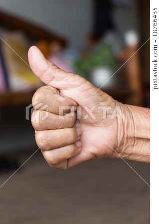 Hand with thumb up .Like sign by old woman Hand with thumb up .Like sign by old woman 18766435