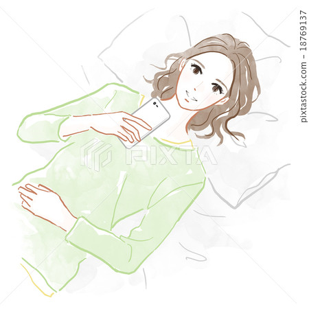 A woman who is lying down and operates a smartphone 18769137