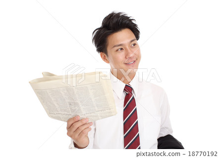 Businessman reading an English newspaper 18770192