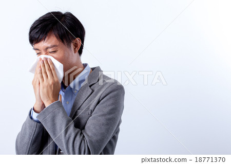 Male blowing nose 18771370