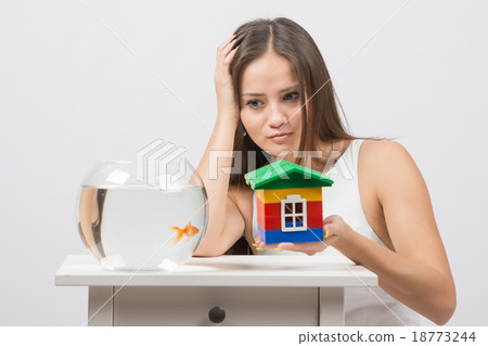 A girl asks her house goldfish 18773244