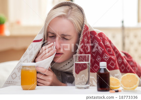 Ill young woman is suffering from flue Ill young woman is suffering from flue 18773336