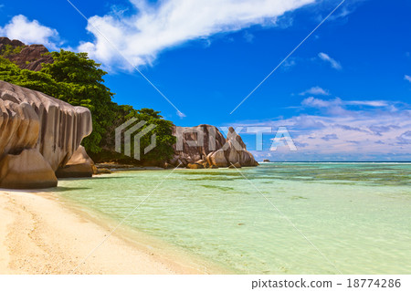 Famous beach Source d'Argent at Seychelles 18774286