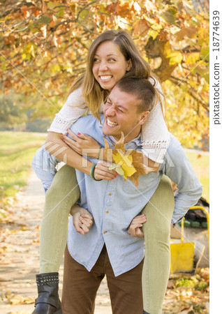 Happy couple in the park having fun 18774639