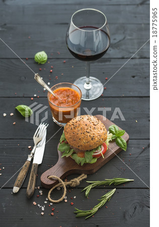Fresh homemade burger on dark serving board with 18775965