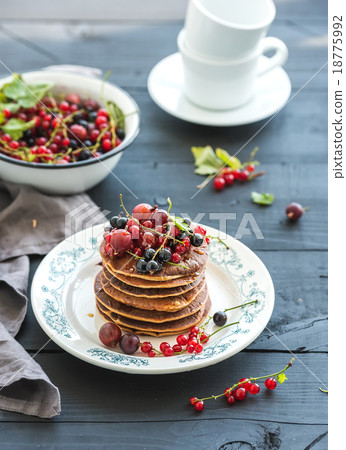 Breakfast set. Buckwheat pancakes with fresh Breakfast set. Buckwheat pancakes with fresh 18775992