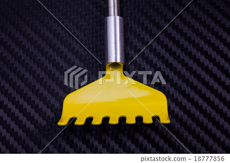 Colorful metallic back scratcher. 18777856