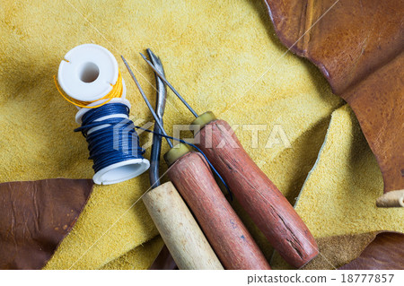 Leather sewing tools on a real leather background. Leather sewing tools on a real leather background. 18777857