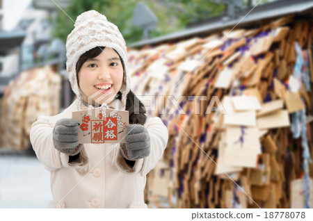 A woman in a courtroom with an ema at a shrine A woman in a courtroom with an ema at a shrine 18778078